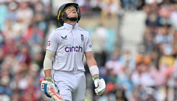 Englands Ollie Pope walks back to the pavilion after losing his wicket for seven runs on day three of the third cricket test match between England and Sri Lanka at The Oval cricket ground in London on September 8, 2024. — AFP