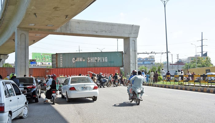 Commuters face difficulties due to road blocked at 9th Avenue, during PTI public gathering (Jalsa) at Sangjani, in the Federal Capital on September 8, 2024. — Online