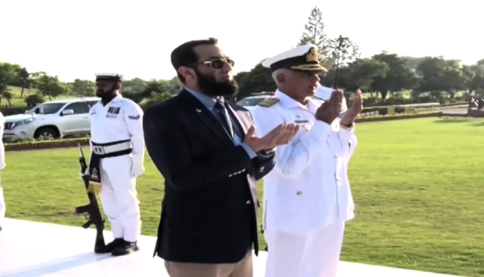 Minister of Information, Broadcasting, National Heritage and Culture Attaullah Tarar praying for the martyrs at the Naval Headquarters with Navy officer on the occasion of Navy Day Pakistan seen in this image on September 8, 2024. — Screengrab/Facebook/@TararAttaullah