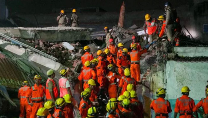 SDRF personnel conduct a rescue operation after a three-storey building collapsed at Transport Nagar area in Lucknow. — PTI