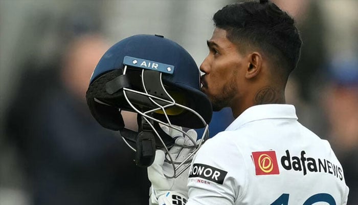 Sri Lanka opener Pathum Nissanka kisses his helmet after completing a hundred against England in the third Test at The Oval. — AFP/File