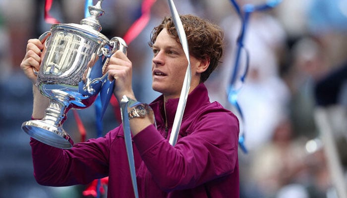 Jannik Sinner of Italy celebrates with the winners trophy after defeating Taylor Fritz of the United States to win the Mens Singles Final on Day Fourteen of the 2024 US Open at USTA Billie Jean King National Tennis Center on September 08, 2024 in the Flushing neighborhood of the Queens borough of New York City. — AFP