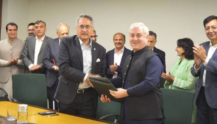 The officials of Aga Khan Foundation Pakistan (AKFP) and Worlwide Fund for Nature-Pakistan (WWFP) posing after signing a MoU on September 9, 2024. — Supplied