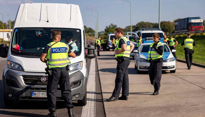 Officers from the German Federal Police stop a van on September 28, 2023, near Frankfurt an der Oder, eastern Germany, along the border with Poland. Polish Prime Minister Donald Tusk on September 10, 2024 condemned as unacceptable neighbouring Germanys decision to tighten border controls in a bid to curb irregular migration. — AFP