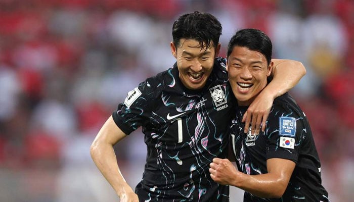 South Koreas forward and captain Son Heung-min celebrates with his striker Hwang Hee-chan after the latter scored a goal during the 2026 FIFA World Cup Asian qualification football match between Oman and South Korea in Muscat on September 10, 2024. — AFP