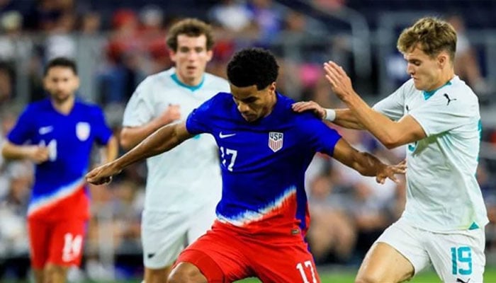 USA midfielder Malik Tillman battles for the ball against New Zealand midfielder Ben Old at the TQL Stadium. — Reuters/file