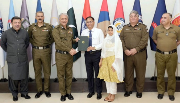 IG Punjab Dr Usman Anwar distributes the order to the newly promoted officer at the Central Police Office on September 11, 2024. — Facebook/Punjab Police Pakistan