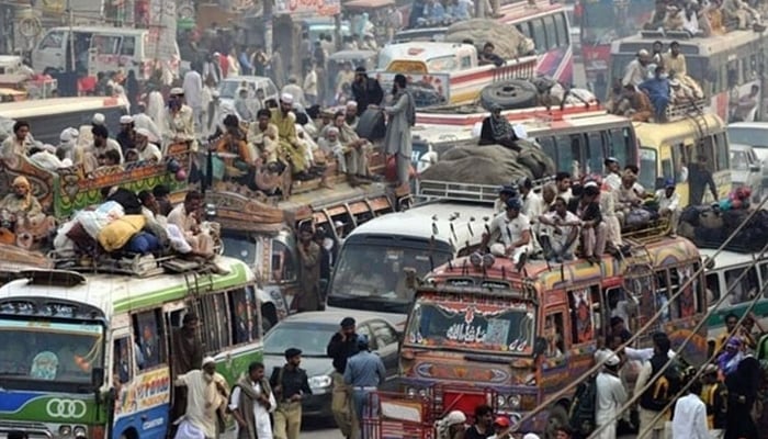 This representational image shows buses and other public transport vehicles filled with passengers. — AFP/File