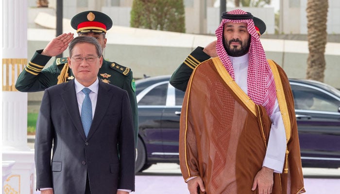 A handout picture provided by the Saudi Press Agency (SPA) shows Saudi Crown Prince Mohammed bin Salman (right) welcoming Chinese Prime Minister Li Qiang (left) in Riyadh, on September 11, 2024. — AFP