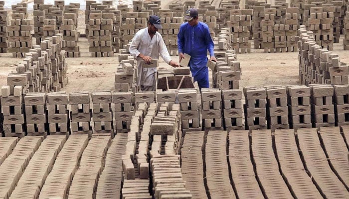 Labourers are busy in their work at brick kilns, as International Labour Day is celebrated on May 1 every year on May 1, 2024. — APP