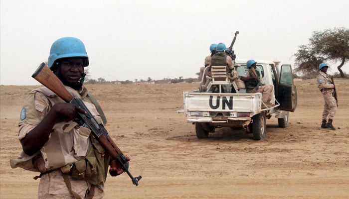 UN peacekeepers stand guard in the northern town of Kouroume, Mali, May 13, 2015. Kourome is 18 km (11 miles) south of Timbuktu. — Reuters