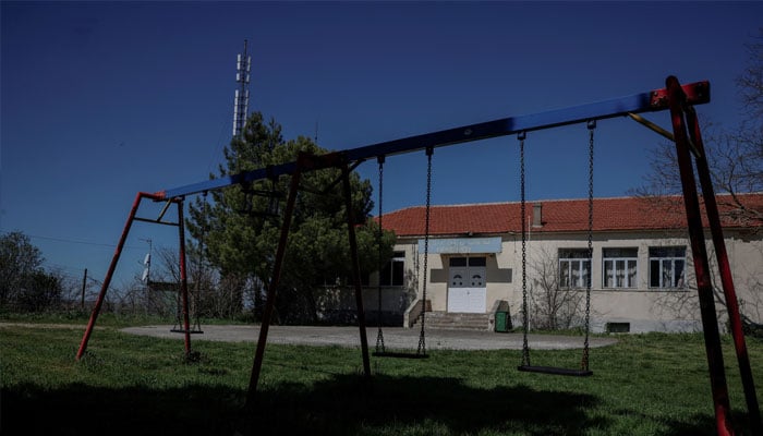 Swings are seen outside the closed school in the village of Ormenio, in the remote crop-growing area bordering Turkey and Bulgaria, northeastern Greece, March 29, 2024. — Reuters