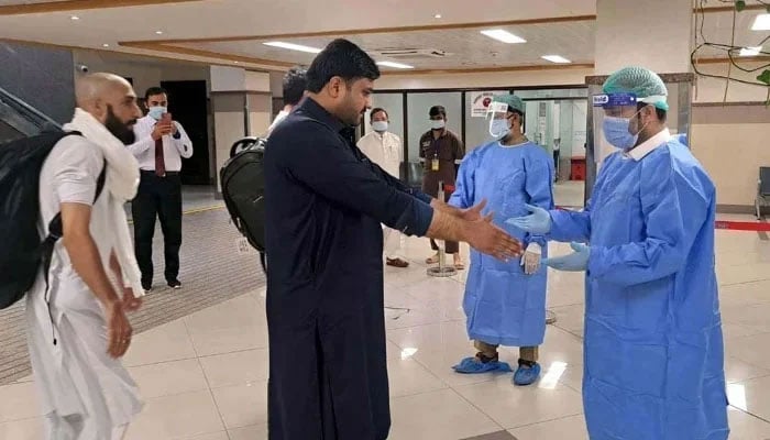 In this photograph taken on April 26, 2018, Pakistani airport staff walks through the Islamabad International Airport on the outskirts of Islamabad. — AFP