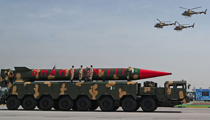 Pakistani military helicopters fly past a vehicle carrying a long-range ballistic Shaheen III missile take part in a military parade to mark Pakistans National Day in Islamabad on March 25, 2021. — AFP/File