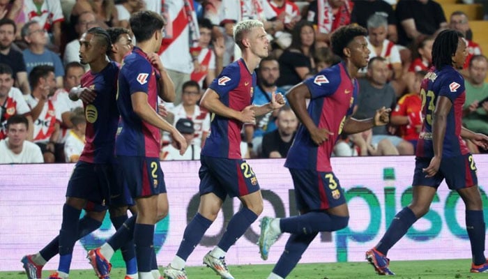 Barcelona team players seen running.— AFP/file