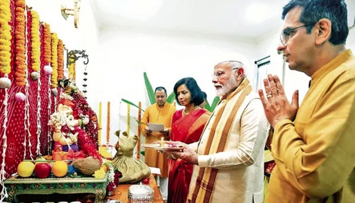 Prime Minister Narendra Modi at the home of Chief Justice of India DY Chandrachud in New Delhi on Wednesday. — PTI