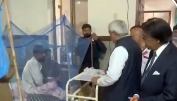 Provincial Minister of Punjab for Specialized Healthcare and Medical Education Dr. Khawaja Salman Rafique talking to a citizen suffering from dengue during a visit to Holy Family Hospital on September 13, 2024. — Screengrab/Facebook/@SalmanRafiquePK