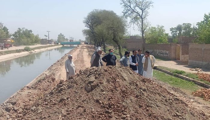 In this image, people are seen near the Warsak Lift Canal (Wach Nehar). — Facebook/Warsak Canals Division, Irrigation Department, KP/File