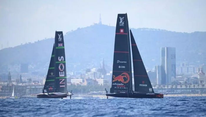 Britains Ineos Britannia (left) will face off against Switzerlands Alinghi Red Bull in the Louis Vuitton Cup semi-finals. — AFP/File