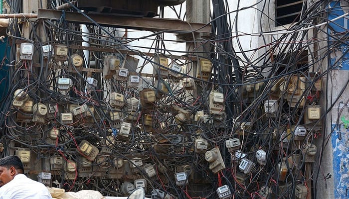 In this image, electricity meters can be seen under a transformer. — APP/File