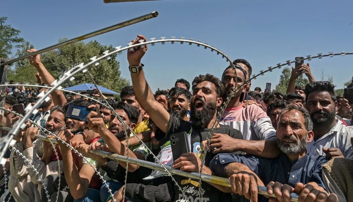 Supporters react as they listen to Sheikh Abdul Rashid also known as Engineer Rashid, a member of parliament from Indian-administered Kashmir, during an election rally in Baramulla on September 12, 2024. — AFP