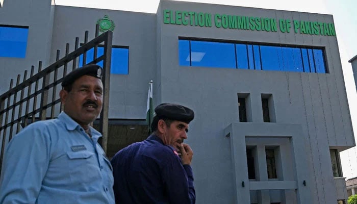 Security personnel stand guard at the headquarters of the Election Commission of Pakistan in Islamabad on September 21, 2023. — AFP