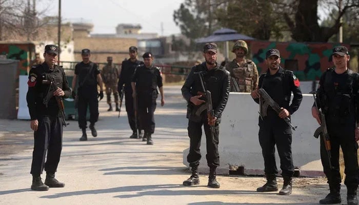 KP police personnel stand guard outside the Haripur central jail in Mardan. — AFP/File