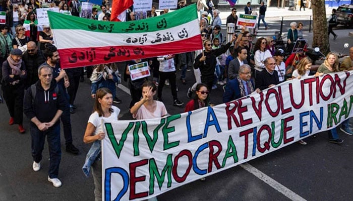 Protesters take part in a march on the second anniversary of a protest movement sparked by the death in custody of Mahsa Amini, 22, arrested for allegedly violating the dress code for women at Place de la Bastille, in Paris on September 15, 2024. — AFP