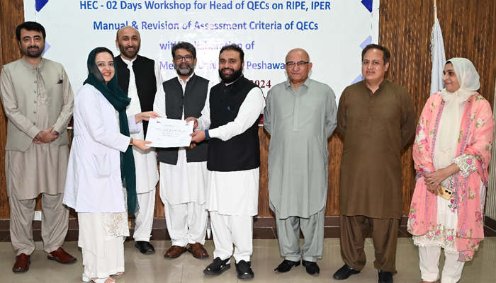 Two-days workshop organised by Khyber Medical University Vice-Chancellor Prof Dr Ziaul Haq (centre) is giving certificates to volunteer. On this occasion Director Higher Education Commission (HEC) Regional Centre Peshawar Dr Nasir Shah, Director of Quality Enhancement Cell KMU Dr Aasiya Bukhari and others are present in this image released on September 15, 2024. — X/@kmuofficial_