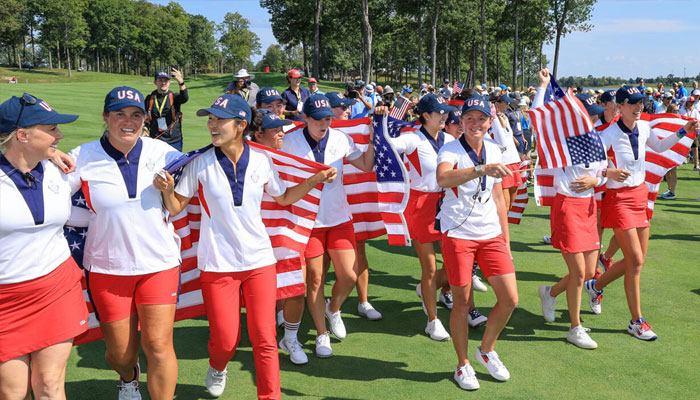 US captain Stacy Lewis, front center, leads the United States team in celebration after beating Europe 15.5-12.5 to win the Solheim Cup . — AFP/file