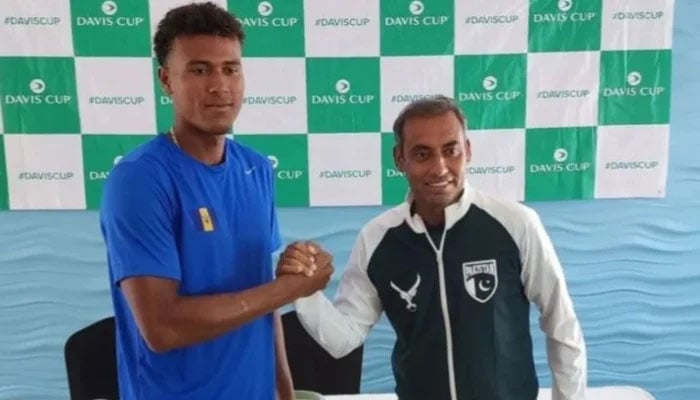 Pakistan tennis player Aqeel Khan posing for a photo with a Barbados player on September 15, 2024. —Instagram/@pakistantennisfederation