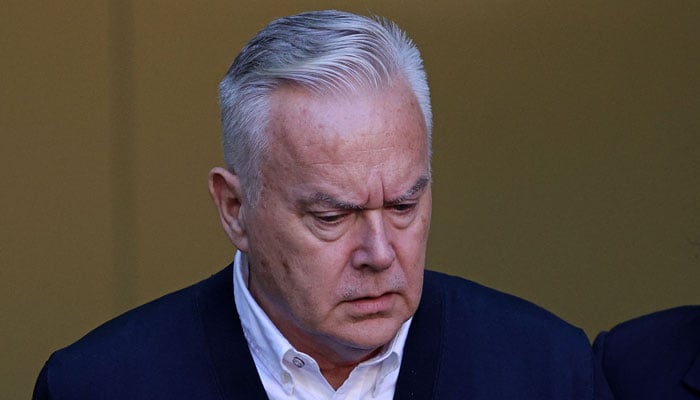 Former BBC news anchor Huw Edwards, one of the most recognisable faces on UK television, reacts as he leaves Westminster Magistrates Court in London on September 16, 2024. — AFP