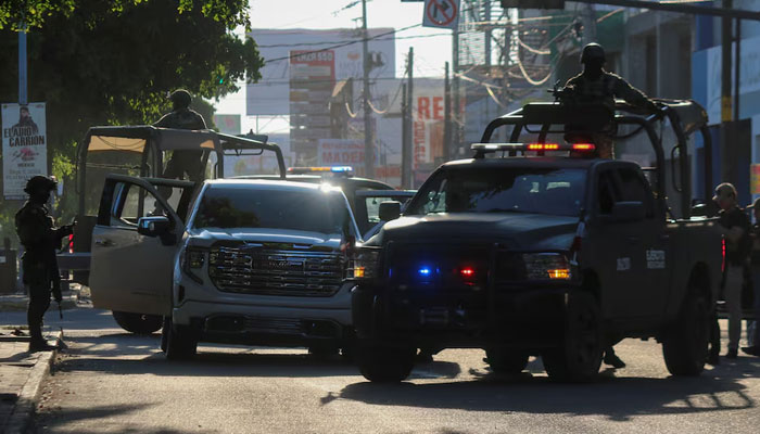 Members of the Mexican Army respond at the scene of a damaged automobile after a confrontation between armed groups, in Culiacan, Mexico September 9, 2024. — Reuters