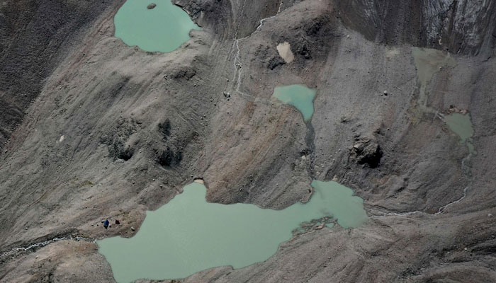 This aerial photograph taken on July 8, 2024 shows lakes of melted water in the Tian Shan mountain range. — AFP