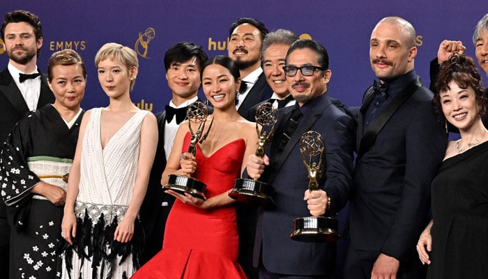 Japanese actor Hiroyuki Sanada (C), alongside cast and crew, winners of Outstanding Drama Series for Shogun pose in the press room during the 76th Emmy Awards at the Peacock Theatre at L.A. Live in Los Angeles on September 15, 2024. — AFP