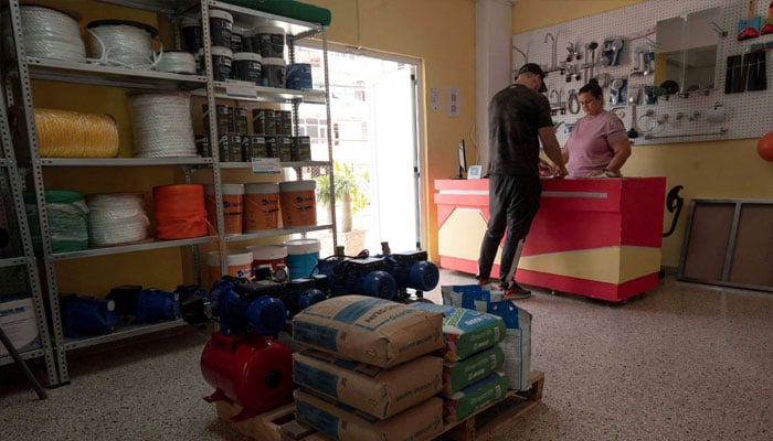 An employee attends a client at a private shop of construction materials in Havana, Cuba, July 11, 2024. —Reuters