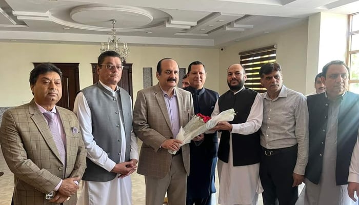 Prime Minister Youth Program (PMYP) Chairman Rana Mashhood Ahmed Khan is presented with a bouquet by members of All Pakistan Marble Industries Association September 10, 2024. — Facebook/@ranamashhoodahmadkhan