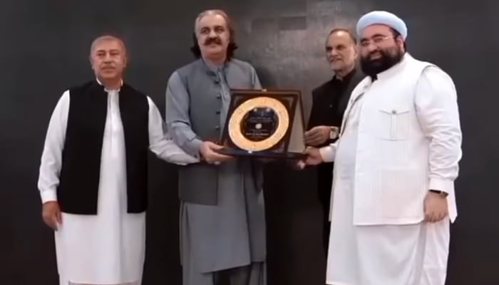 Chief Minister KP Ali Amin Gandapur presenting shield to Aalim-e-Deen at Rahmatul Alameen Conference on the occasion of Eid Milad-ul-Nabi seen in this image on September 18, 2024. — Screengrab/Facebook/@AliAminKhanGandapurPti