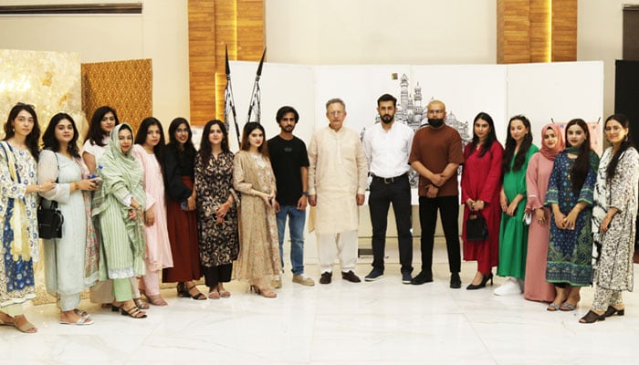 Participants pose for a group photo in the Final Textile Thesis Display 2024 at the Iqra University, H-9 Campus on September 19, 2024. — Facebook/Iqra University, Islamabad Campus