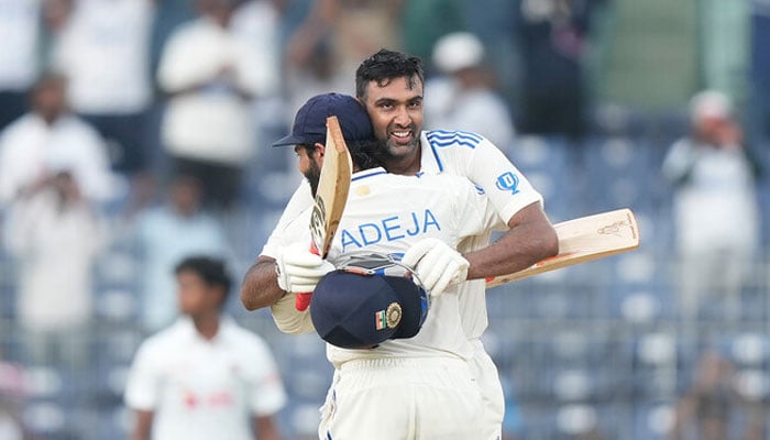 Indias Ravichandran Ashwin celebrates after scoring a century with Ravindra Jadeja on the first day of the first cricket test match between India and Bangladesh, in Chennai, India, on September 19, 2024. — AFP