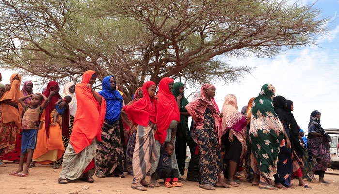 Internally displaced Ethiopians queue to receive food aid in the Higlo camp for people displaced by drought in the town of Gode, Somali Region, Ethiopia, April 26, 2022. — Reuters