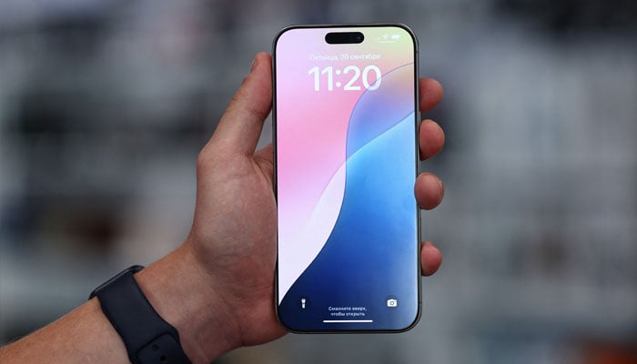 A man holds an Apple iPhone 16 Pro Max ahead of the launch of sales of the new iPhone 16 series smartphones in a store in Moscow, Russia September 20, 2024. — Reuters