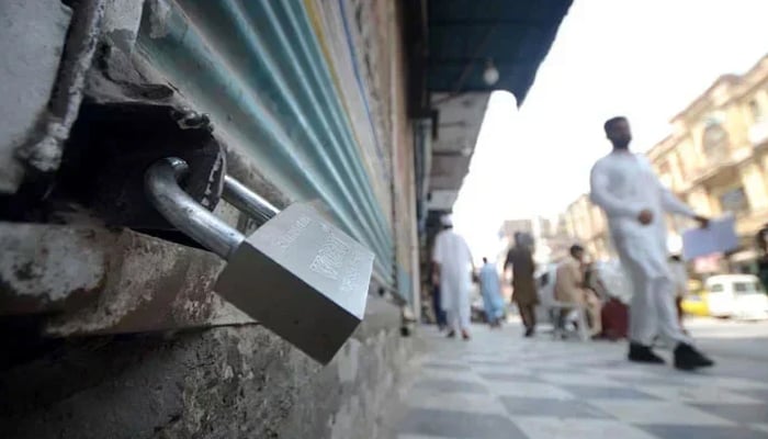 A representational image shows a view of a closed shop. — INP/File