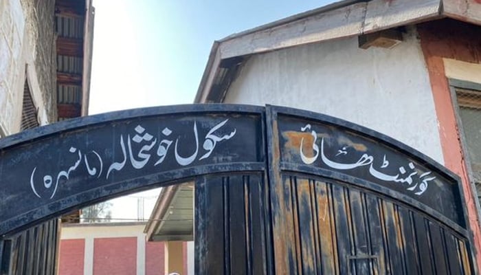 Government High School Khushala name written on the school entrance gate seen in this image. — AFP/File