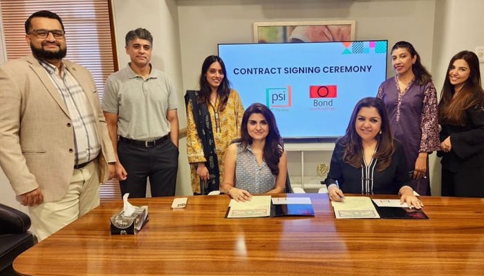 Population Services International (PSI) Pakistan’s Country Director Ayesha Leghari and CEO of Bond Advertising Seema Jaffer signing a contract signing on documents seen in this image released on 20, 2024. — LinkedIn/@bondadvertising?trk=public_post_feed-actor-name