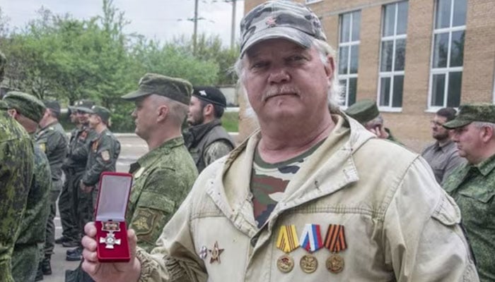 US citizen Russell Bentley displays a combat veteran medal awarded to him during a ceremony in Donetsk. — X/@BonnerRuss15620/file