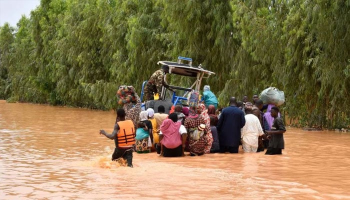 An image of people stuck in flood in Niger.— AFP/file