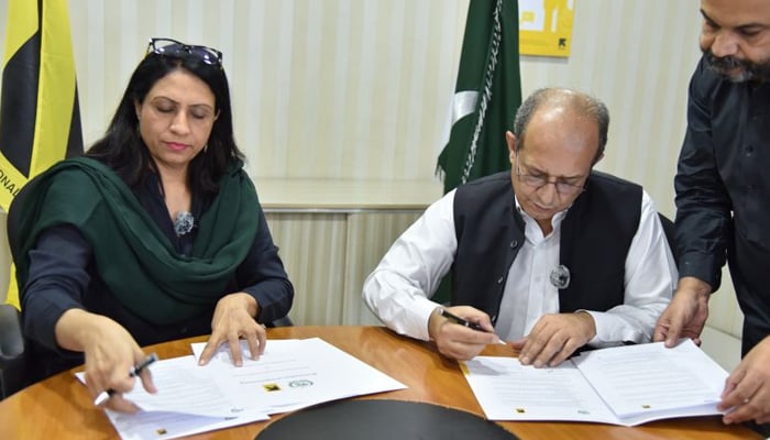 Country Director International Rescue Committee in Pakistan Shabnam Baloch (left) and Chief Commissioner Afghan Refugee (CCAR) Muhammad Abbas Khan (right) both are Signing on the Memorandum of Understanding seen in this image September 20, 2024. — LinkedIn/@international-rescue-committee-pakistan?trk=public_post_feed-actor-name