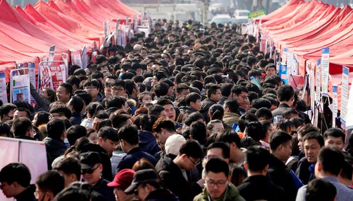 Job seekers crowd a job fair at Liberation Square in Shijiazhuang, Hebei province, China. — Reuters/File