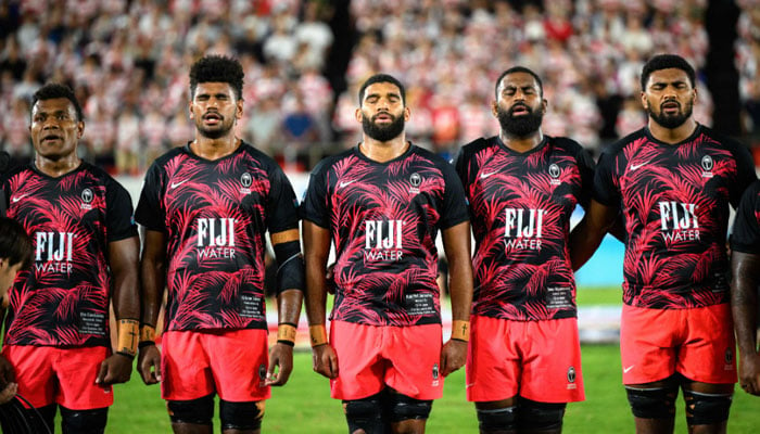 Fijis players sing the national anthem before the Pacific Nations Cup final rugby union match between Japan and Fiji at the Hanazono Rugby Stadium in Higashiosaka on September 21, 2024. — AFP